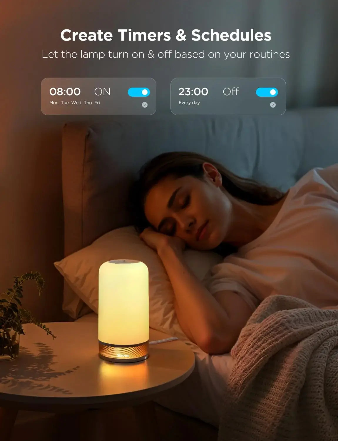 Govee H6022 table lamp with timer and schedule feature, glowing softly beside a sleeping person on a bedside table.