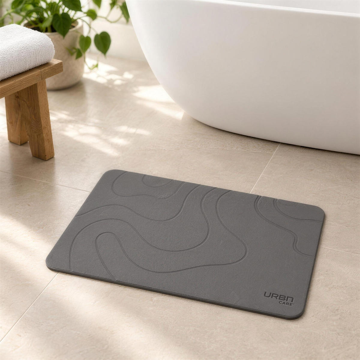 UrbnCare® diatomite bath mat in Dark Grey in a bright bathroom